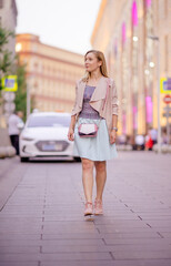 Obraz premium Beautiful young girl smiling on sunny street. Lifestyle Concept