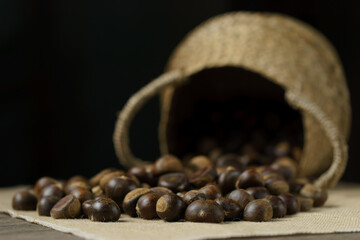 Close-up of wicker basket with full of chestnuts.