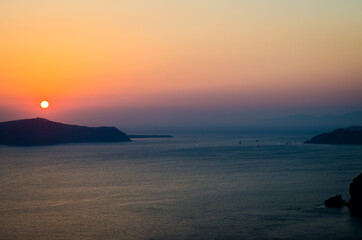 Sunset over an island in Greece, Santorini. 