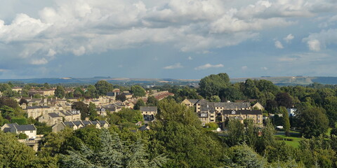 Fototapeta na wymiar Scenic view of a beautiful town set amongst green leafy trees - namely the historic town of Bradford on Avon in Wiltshire England