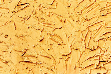 Creative beautiful bright yellow background, cracks and scratches on the concrete. Grungy concrete surface. Great background or texture for your project.