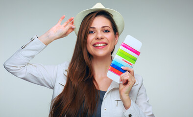 Happy woman ready to traveling with passport.