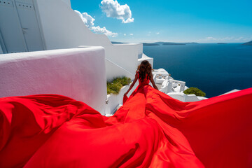 Beautiful Woman Run In Red Fluttering Dress in Santorini