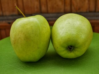 green apples on a wooden table