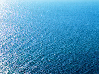 Blue landscape background sea surface backlit morning light of the setting sun in a wide range of brightness. For creative design