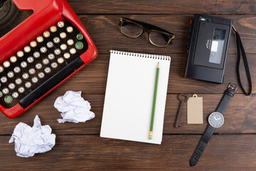 Journalism or blogging concept vintage typewriter on the wooden desk, top view