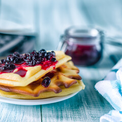 Pancakes with jam. Photo of a glass of tea and pancakes.
