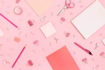 Pattern made of school supplies on a pink pastel background. Monochrome creative backdrop.