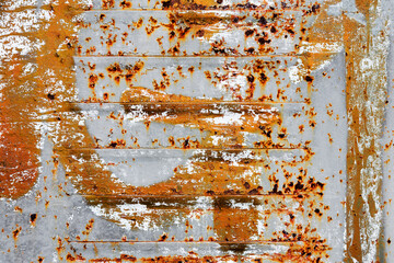 Creative background of rusty metal with cracks and scratches, carelessly painted paint. Grungy...