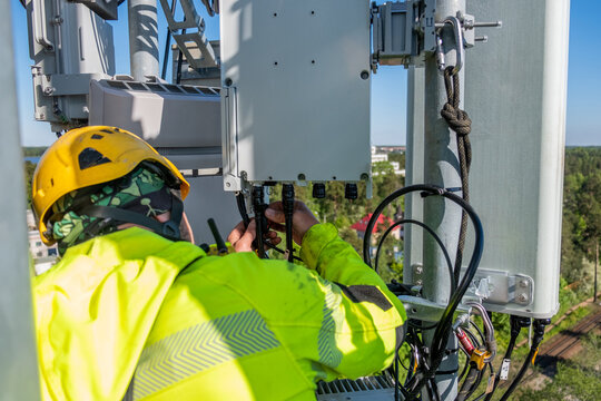 Cell Phone Installers Work On The Tower