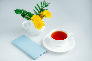 Morning tea with smartphone.