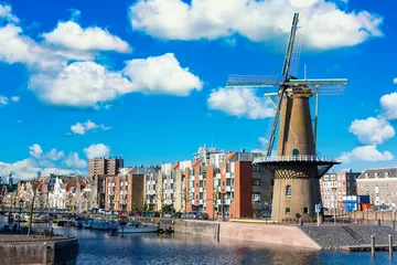 Foto op Canvas The historic Delfshaven district with windmill in Rotterdam, The Netherlands. South Holland region. Summer sunny day © Nikolay N. Antonov