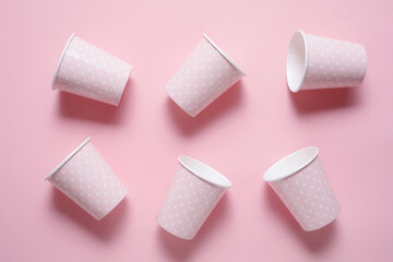 Pattern from six Pink Paper Drinking Cups on pink Backgrounds. Birthday Party Celebration Abstract Fashion Baby Shower Concept. Pastel Colors. Minimalist Style