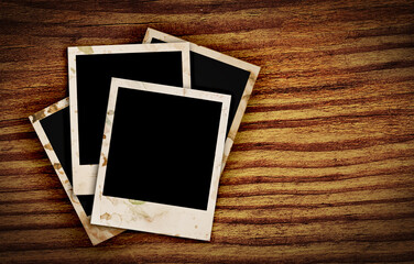 old photo frames on wood background