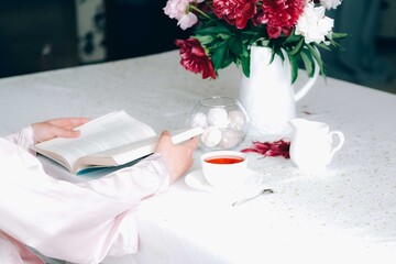 Morning tea with a book.