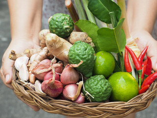 Herb basket consists of garlic, shallot, lime, lemongrass, kaffir lime leaves, red hot chili...