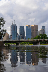 Obraz na płótnie Canvas Rippled water reflections of the Melbourne CBD.