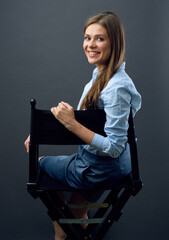 Smiling woman sitting back on chair