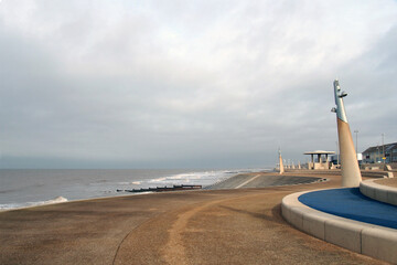 The curved promenade along the seafront at cleveleys in blackpool with steps leading to the beach © Philip J Openshaw 