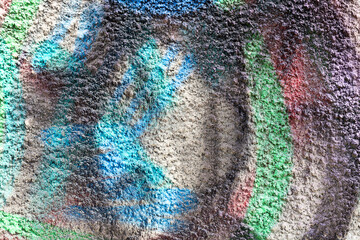 Shabby building facade with damaged plaster. Painted distressed wall surface. Grungy wide concrete...