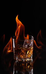 whiskey on fire on a dark background burning
