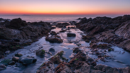 Fototapeta na wymiar Sunrise over the sea in Guernsey.