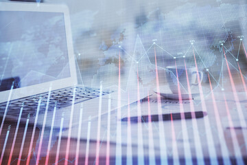 Forex graph hologram on table with computer background. Double exposure. Concept of financial markets.
