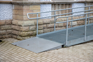 Wheelchair ramps to the building front door 