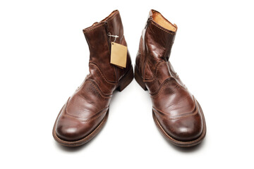 Two brown shoes with untied laces on a white isolated background