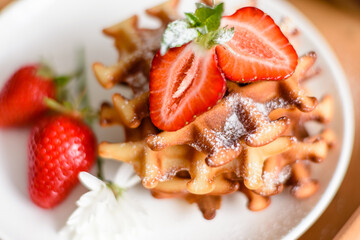Delicious fresh baked belgian waffles with berries and fruit