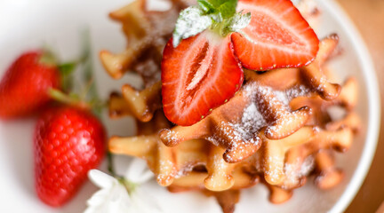 Delicious fresh baked belgian waffles with berries and fruit