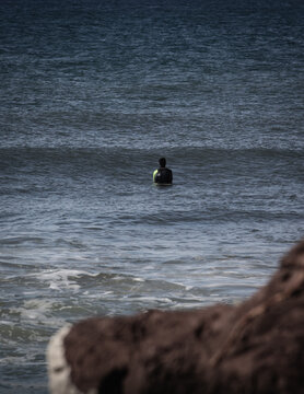 Lone Surfer In The Sea