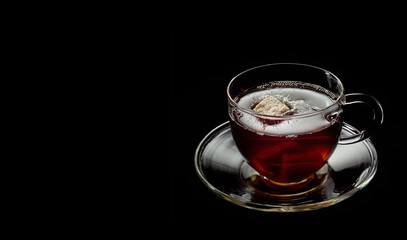 cip of tea on the black background