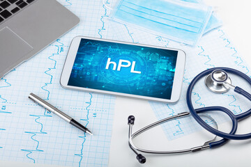 Close-up view of a tablet pc with hPL abbreviation, medical concept