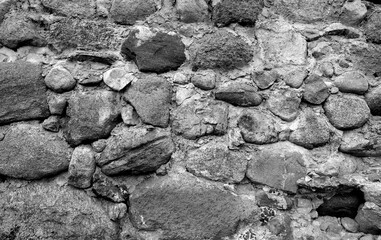 Old stone wall texture. black and white