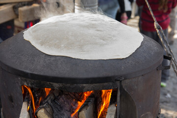 Traditional Druze Pita bread, baked on a Saj or Tava, on open fire
