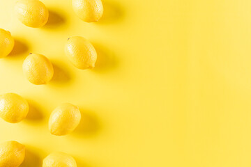 Top view of fresh lemon on pastel yellow background. Food concept. Flat lay, top view, copy space