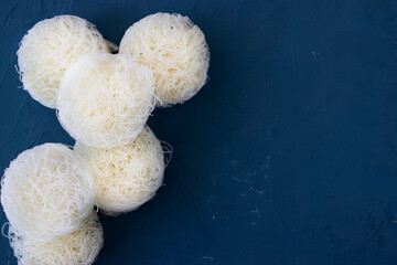 Dry funchose on a blue cement background.