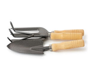 set of shovels, rakes and a view with a wooden handle for the garden