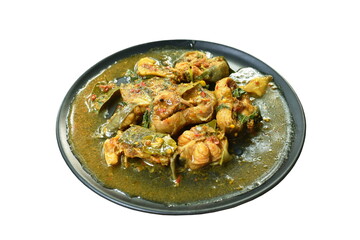 spicy stir fried catfish curry with herb on black plate 