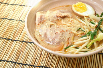 miso ramen or Japanese yellow noodles topping slice braised pork in soybean soup on bowl