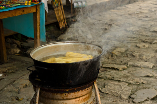 cooking corn in a cascade of blue water, Chiapas. Mexico