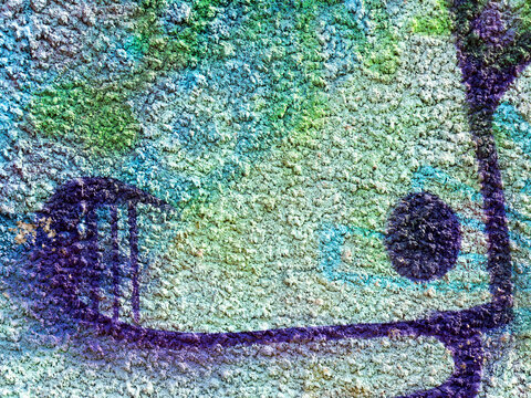 Landscape style. Grungy concrete surface with cracks, scratches traces of blue and green paint on the walls. Great background or texture. © Elena