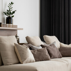 Elegant beige corner sofa, close-up