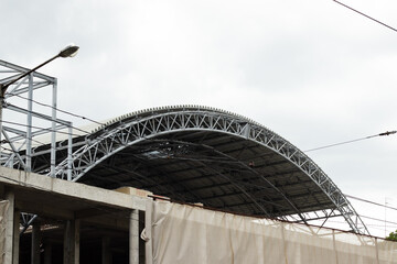 A metal arc construction of the roof