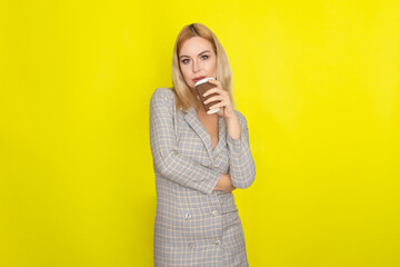 Business blonde woman with cup of coffee