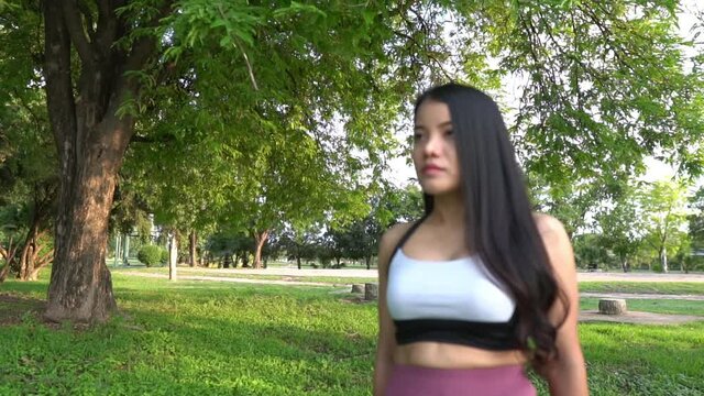 Beautiful asian fat woman play yoga at the park,Need to slim fit body	
