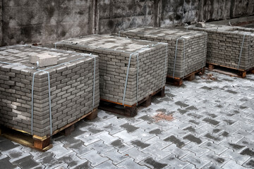 Pallets with folded paving slabs