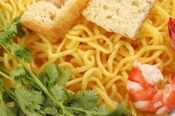 Fresh yellow egg noodle prawn tofu coriander leaf on whit background