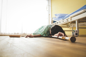 The female patient fell on the floor beside the bed in the recovery room of the hospital. First aid...